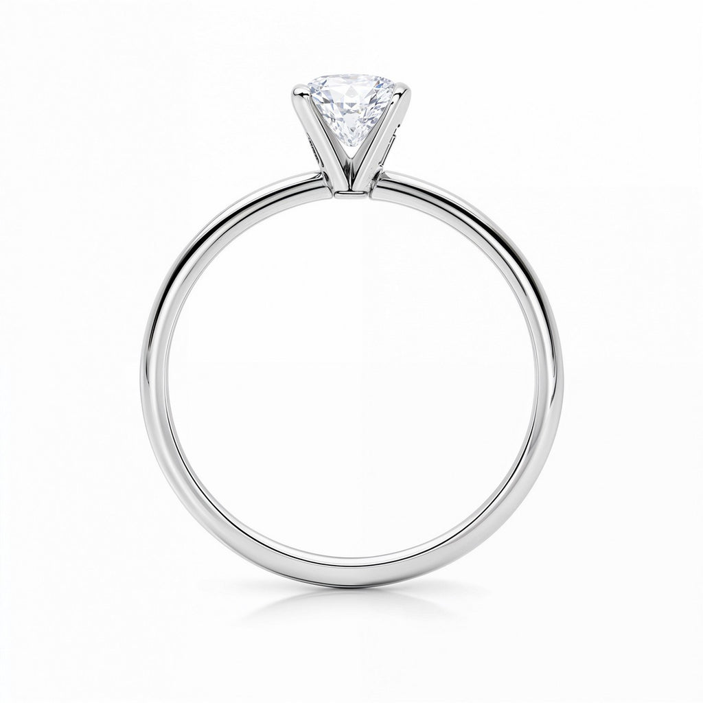 14k white gold solitaire ring featuring a radiant 1 1/2 carat IGI G/VS1 diamond in a modern prong setting.