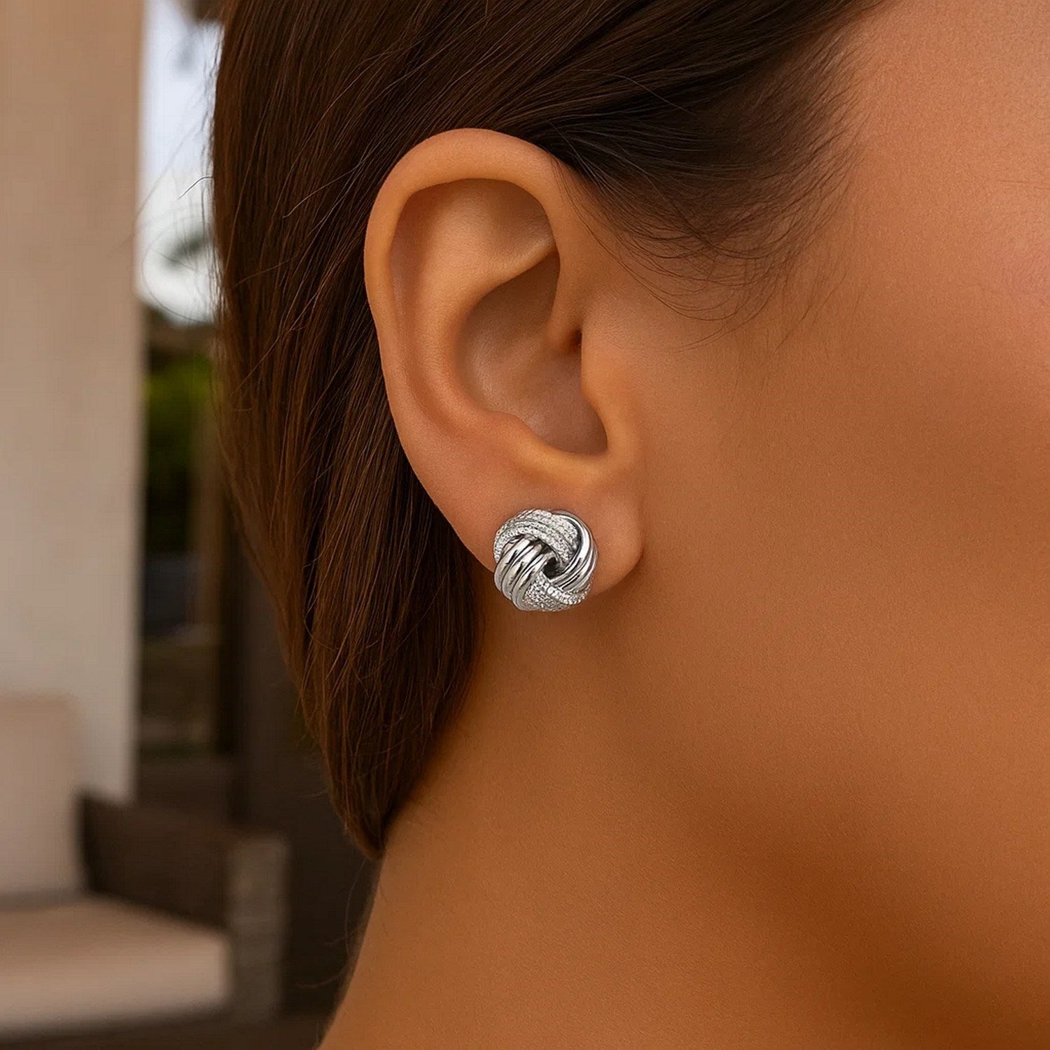 14k white gold polished love knot earrings featuring a contemporary design, perfect for elegant occasions.