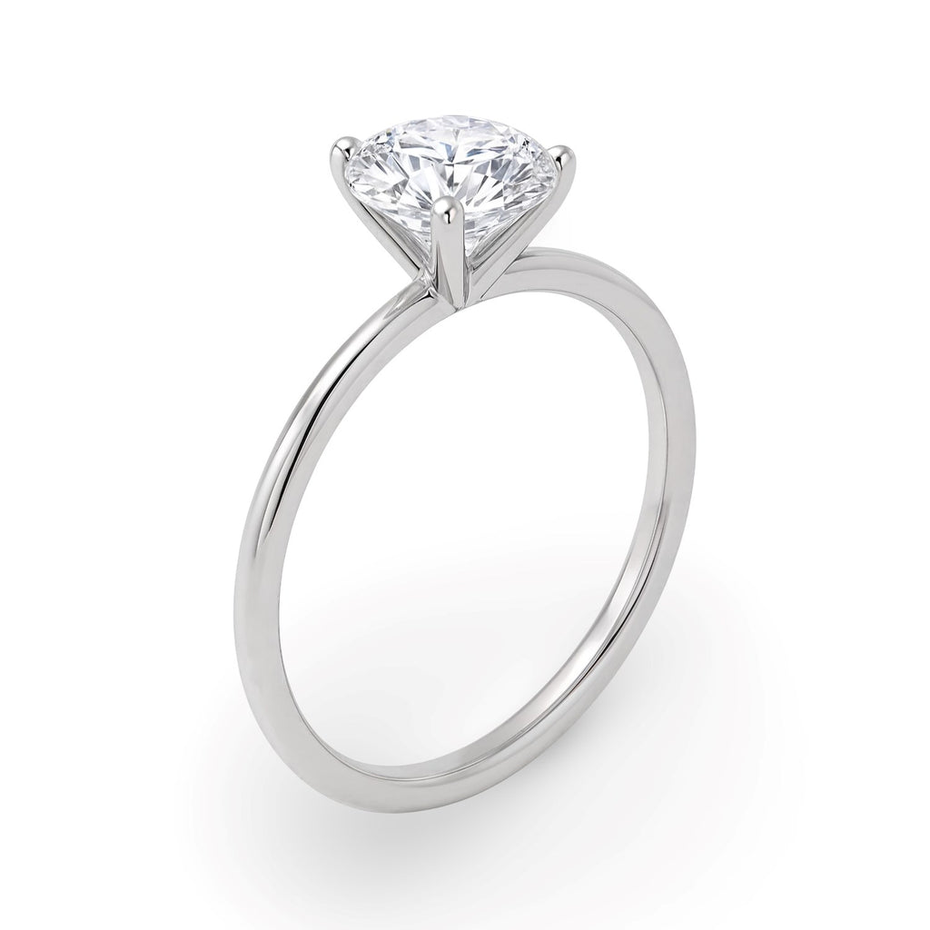 1 1/2 carat round lab-grown diamond solitaire ring in 14k white gold with elegant prong setting, showcasing timeless luxury.