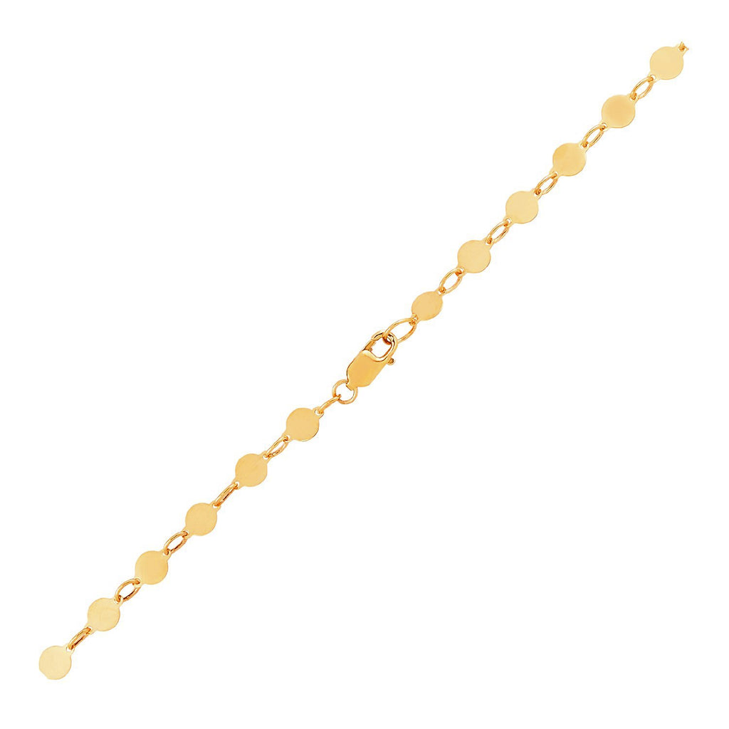 14k yellow gold modern bracelet featuring polished circles and a delicate chain link design.