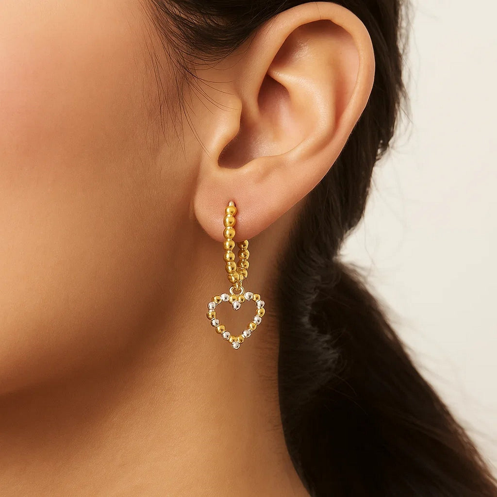 14k two-tone gold textured beaded hoop earrings exuding modern elegance and luxury craftsmanship.