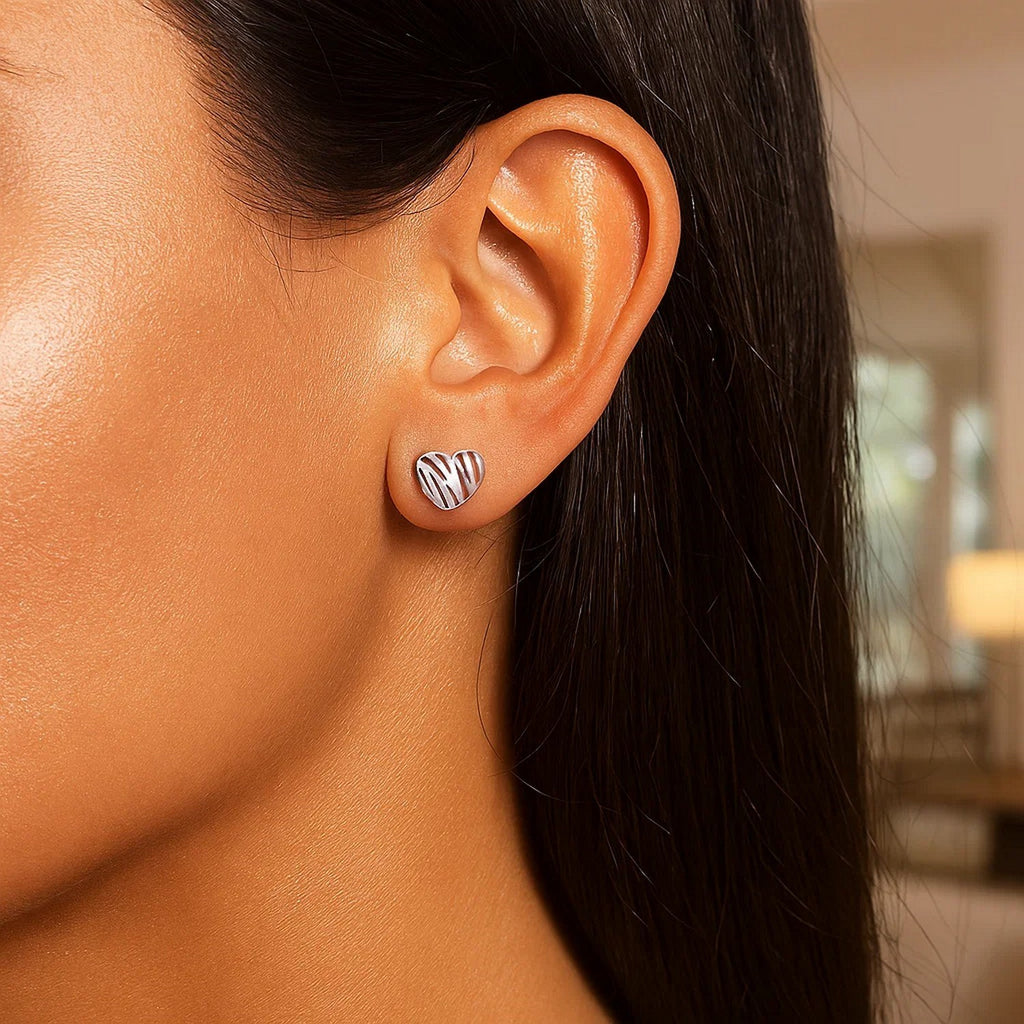 14K white gold high polish stud earrings in a modern scribble heart design, perfect for elegant occasions.