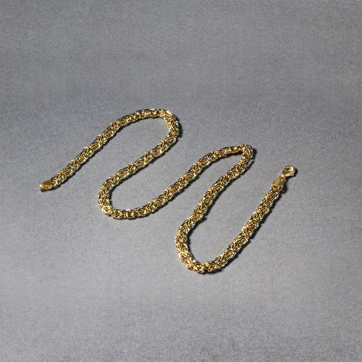 14k yellow gold fancy Byzantine chain necklace with modern design and elegant stud detailing.