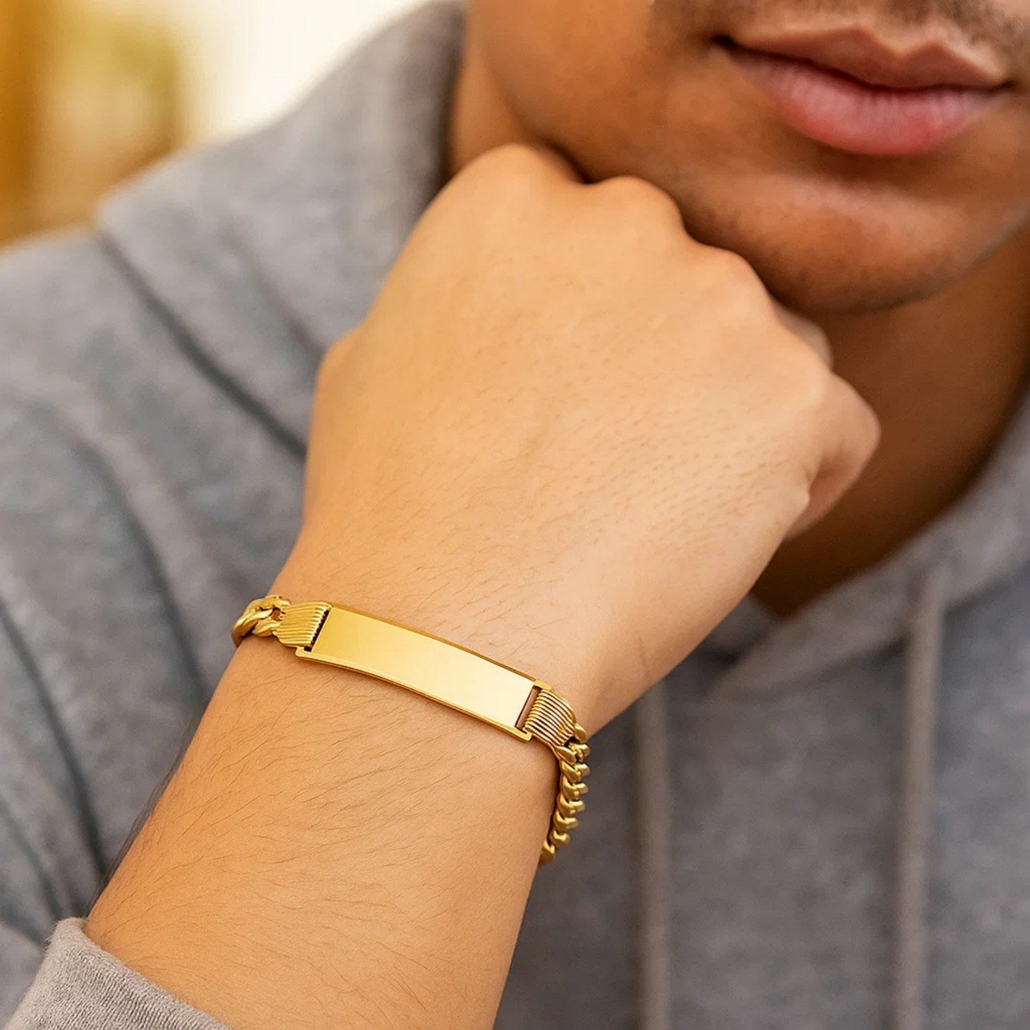 14K yellow gold Lite Cuban ID bracelet featuring modern chain link design, perfect for elegant styling.