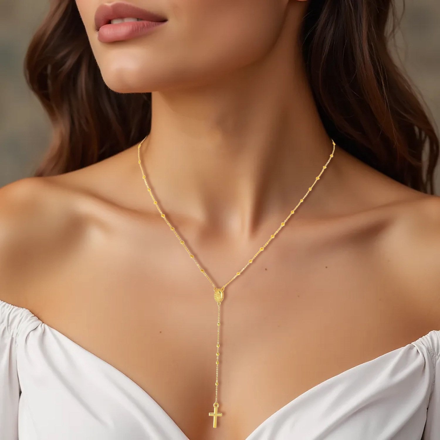 14k yellow gold rosary necklace featuring a modern design with delicate chain and stud accents.