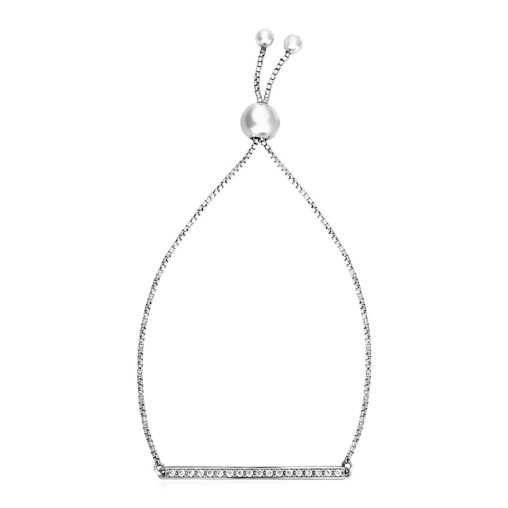 Adjustable sterling silver bar bracelet adorned with sparkling cubic zirconia in a modern prong setting.