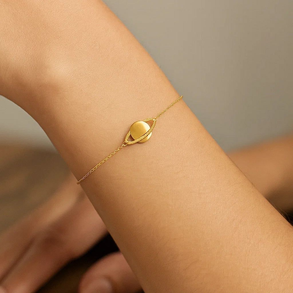 14k yellow gold modern Saturn bracelet featuring elegant chain link design for a luxurious touch.