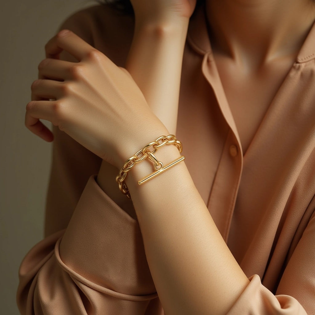 14k yellow gold bracelet featuring alternating oval and round links with a modern toggle clasp design.