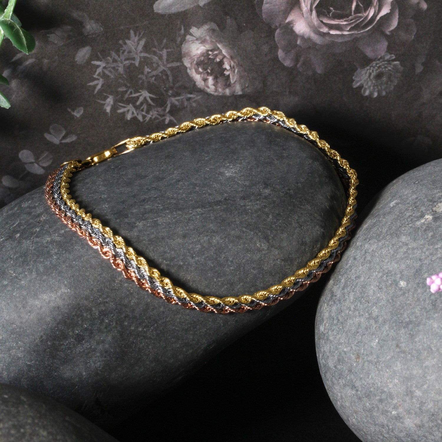 Tri-toned 10k gold multi-strand rope chain bracelet featuring modern design and luxurious 14k gold craftsmanship.