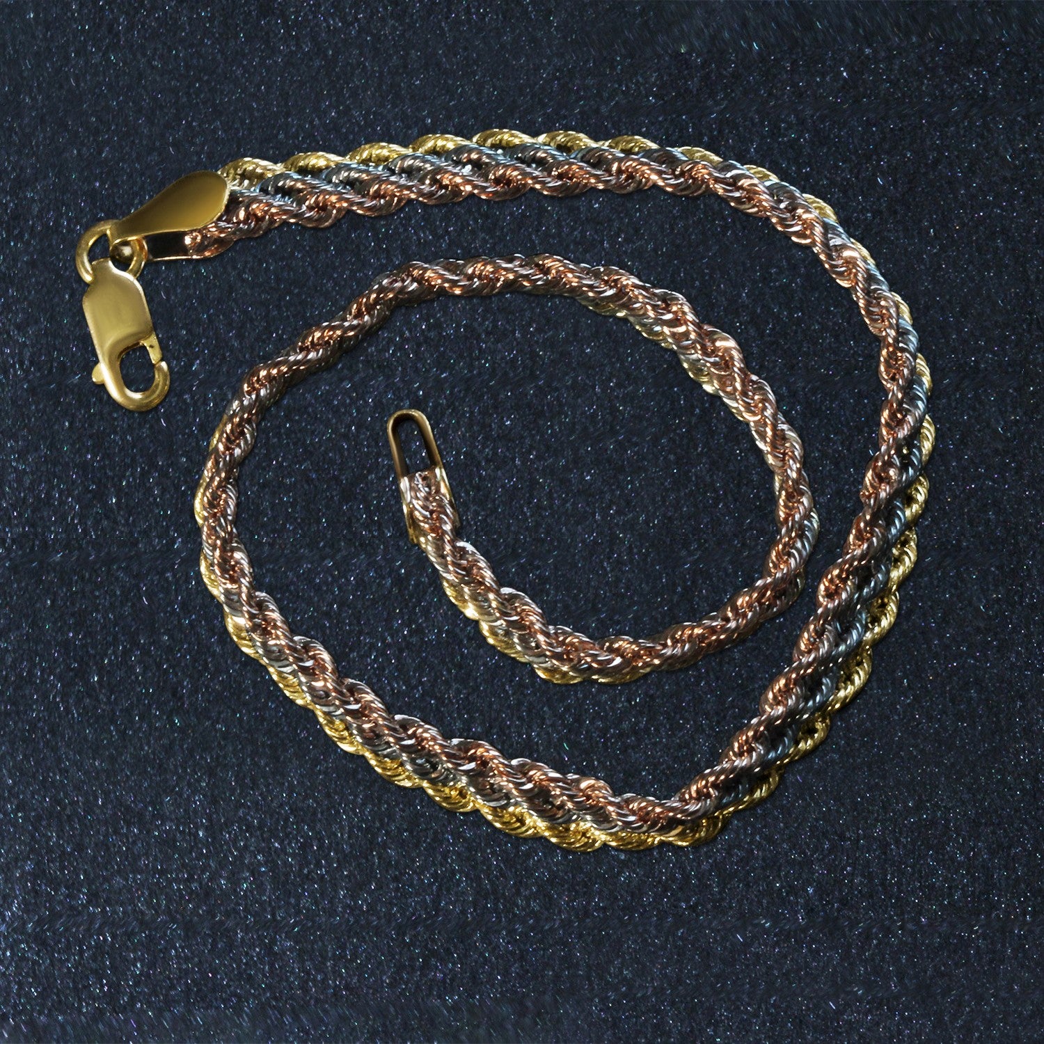 14k tri-toned gold multi-strand rope chain bracelet, modern design with luxurious texture and elegant shine.