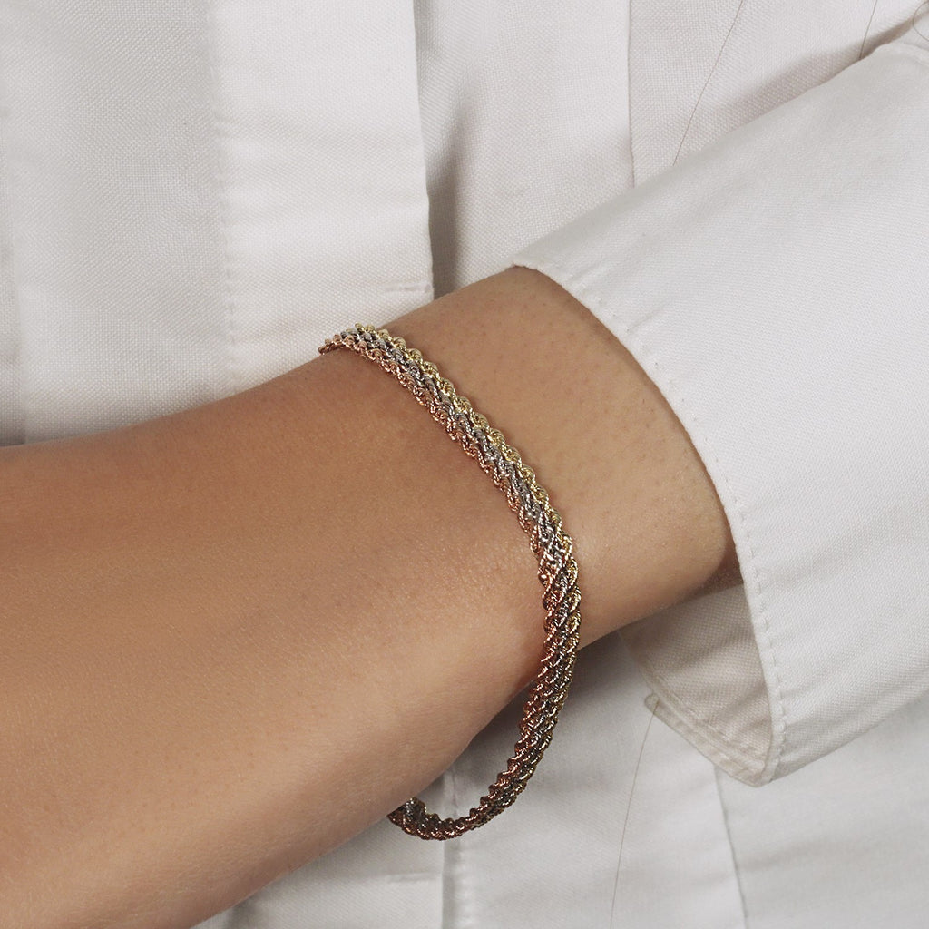 10k tri-toned gold multi-strand rope chain bracelet in modern design, crafted from luxurious 14k gold.