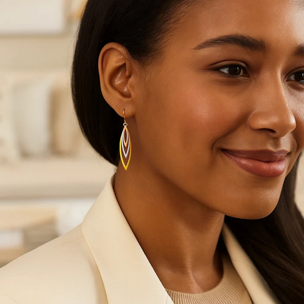 10k tri-tone gold graduated open marquise dangle earrings showcasing a modern design with elegant movement.