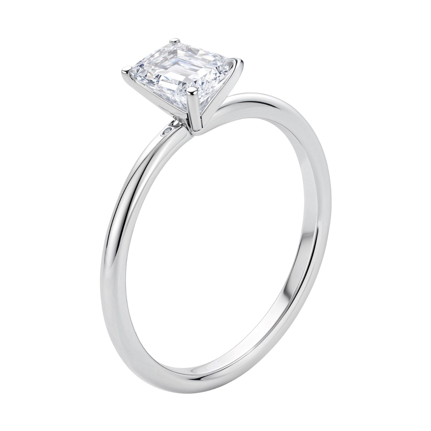 14k white gold solitaire ring featuring a 1 carat emerald and IGI G/VS1 diamond in a classic prong setting.