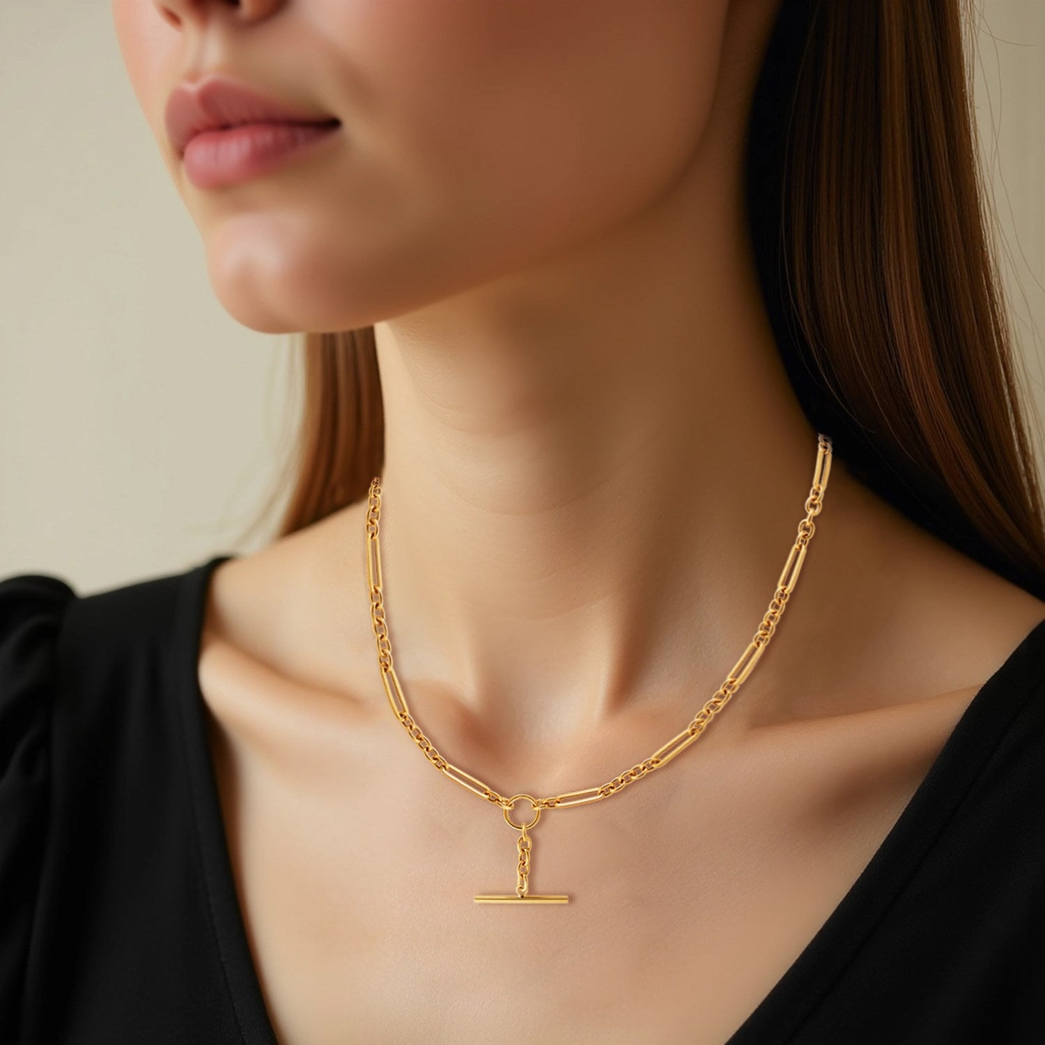 14k yellow gold necklace featuring alternating oval and round links with a modern toggle clasp for a chic look.