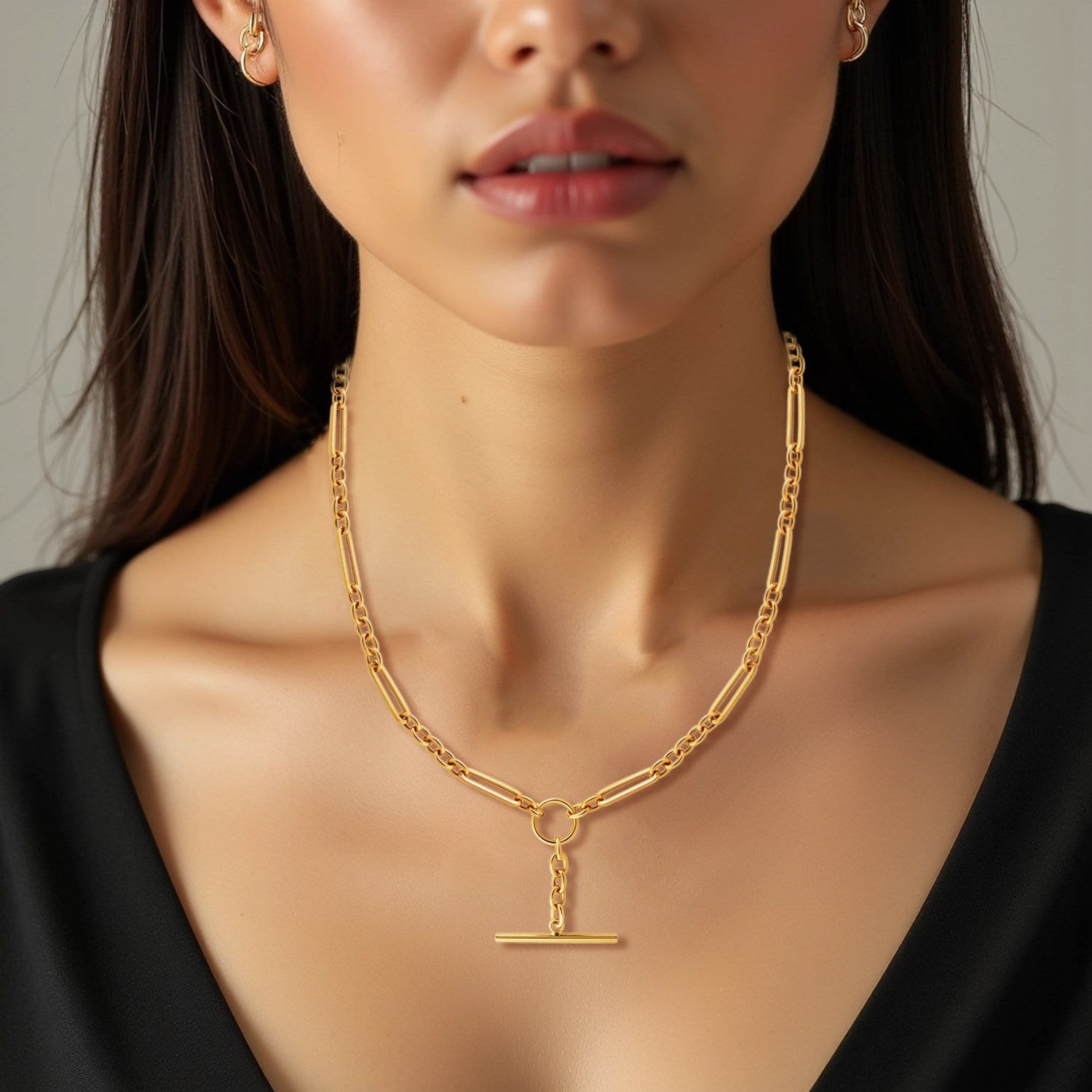 14k yellow gold necklace featuring alternating oval and round links with a modern toggle clasp design.