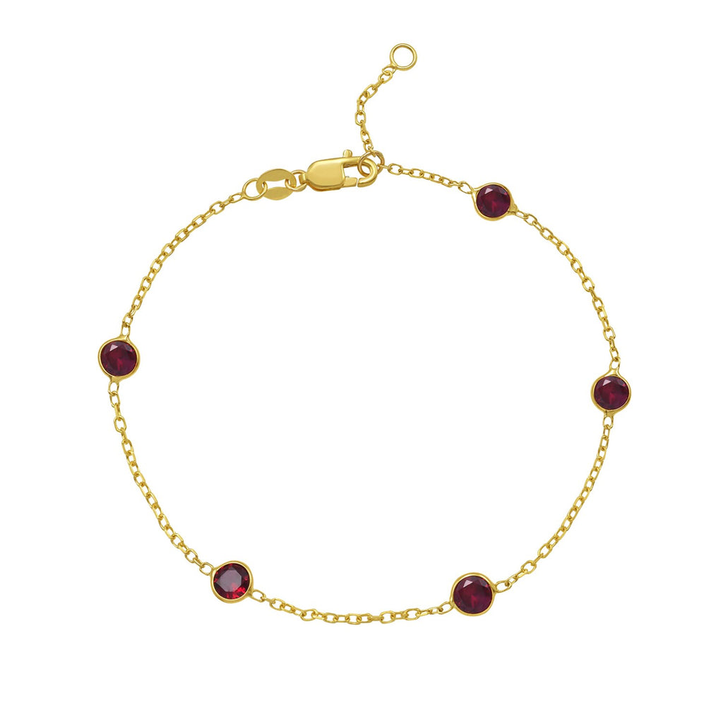 14k yellow gold ruby station bracelet featuring bezel settings and a modern chain design for elegant sophistication.