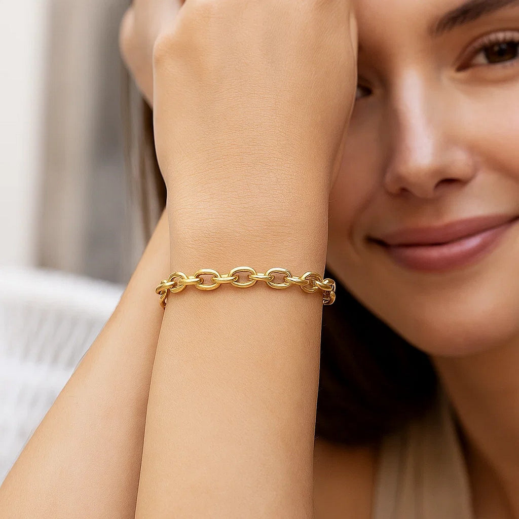 14k yellow gold charm lock rolo chain bracelet with modern link design, showcasing elegance and luxury craftsmanship.