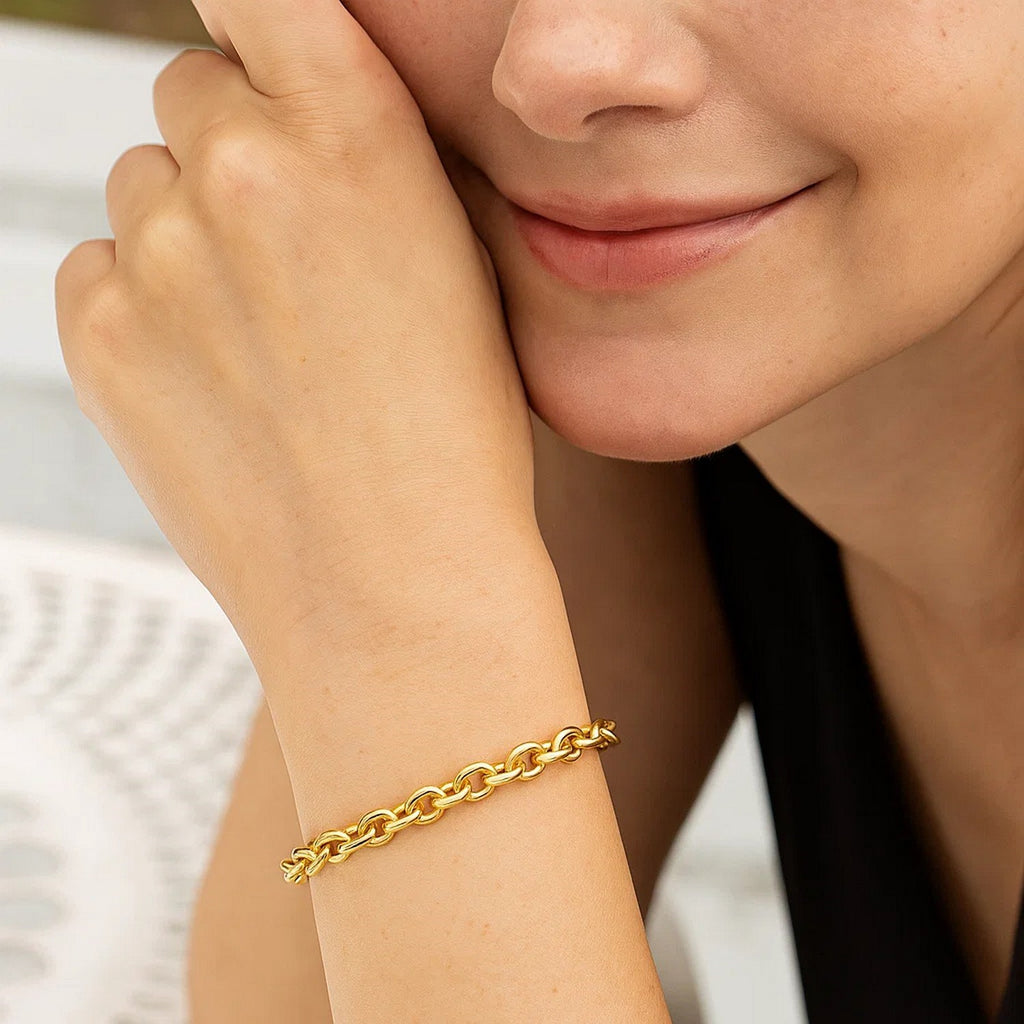 14K yellow gold charm lock rolo chain bracelet with modern link design, showcasing elegance and luxury craftsmanship.