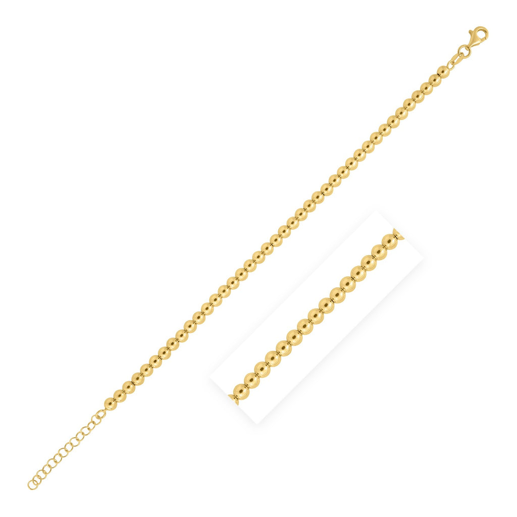 14k yellow gold bead bracelet featuring modern design with elegant stud accents, perfect for luxury styling.