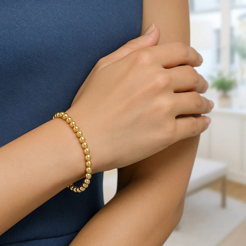 14k yellow gold bead bracelet featuring modern design and elegant stud detail, perfect for luxury jewelry collections.