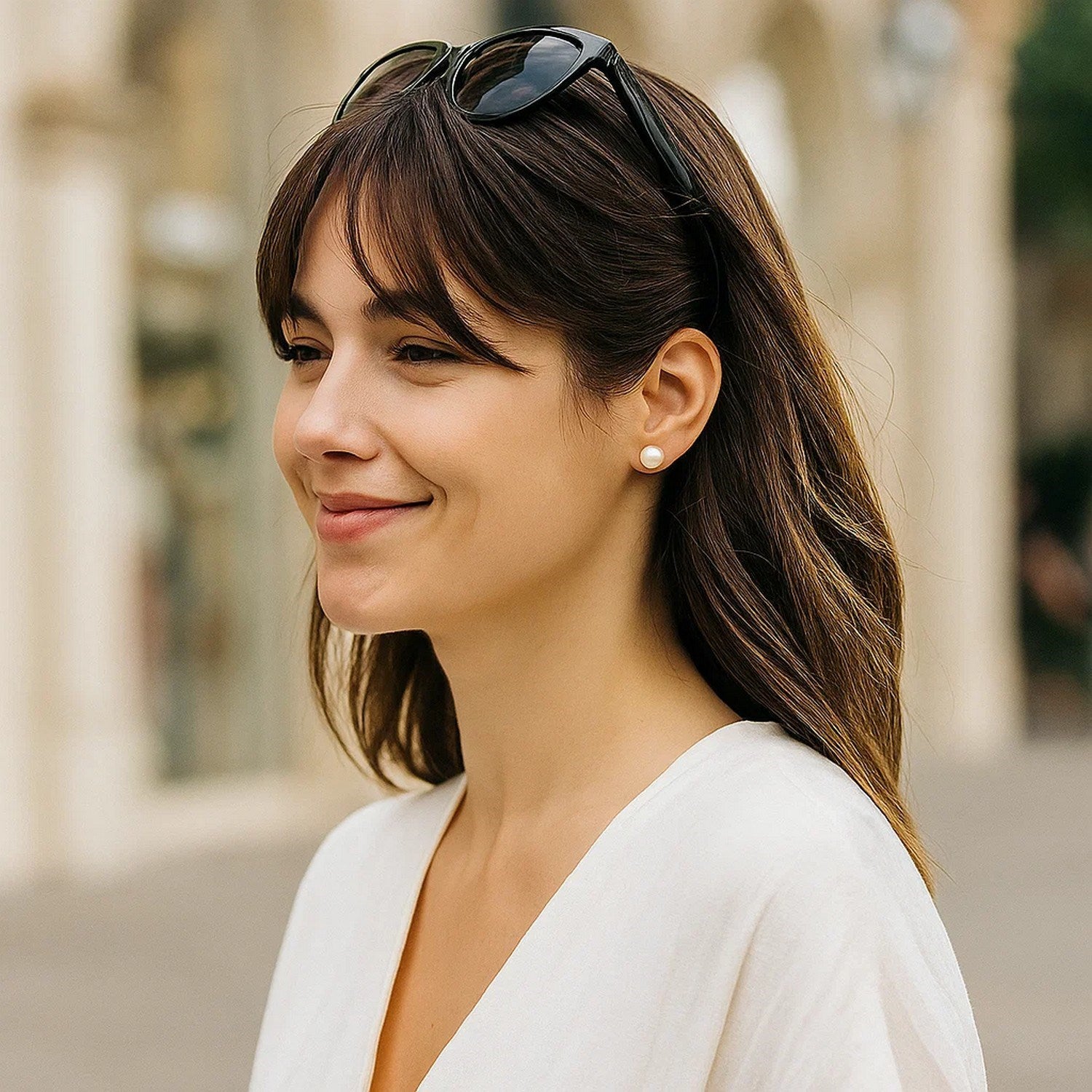 14k yellow gold stud earrings featuring 7mm round freshwater cultured pearls for a timeless, elegant look.