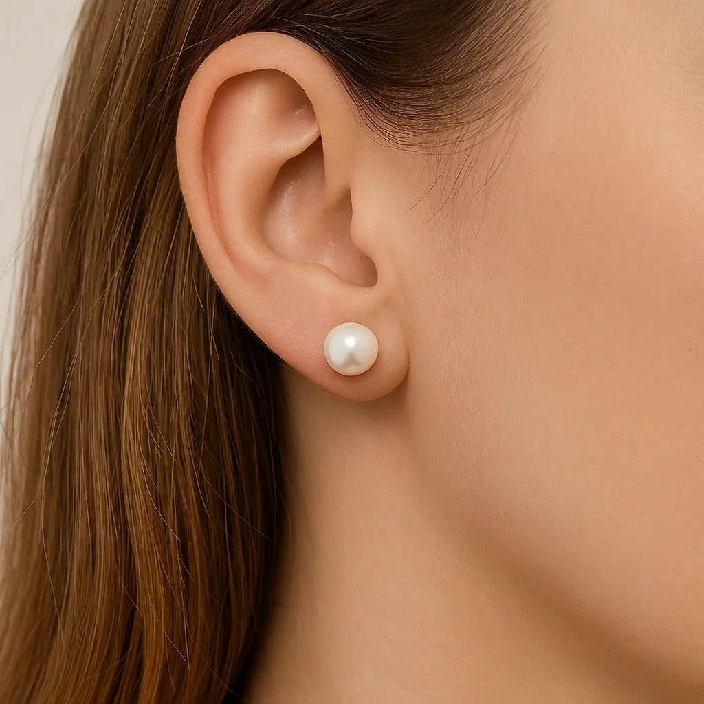 14k yellow gold stud earrings featuring 7mm round freshwater cultured pearls for a timeless, elegant look.