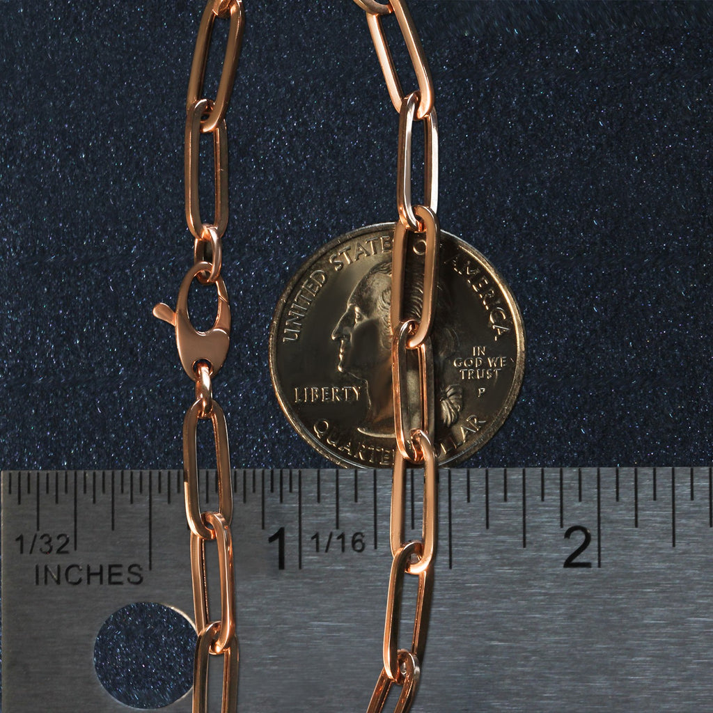 14k rose gold bold paperclip chain bracelet featuring modern links, perfect for elegant layering or standalone wear.