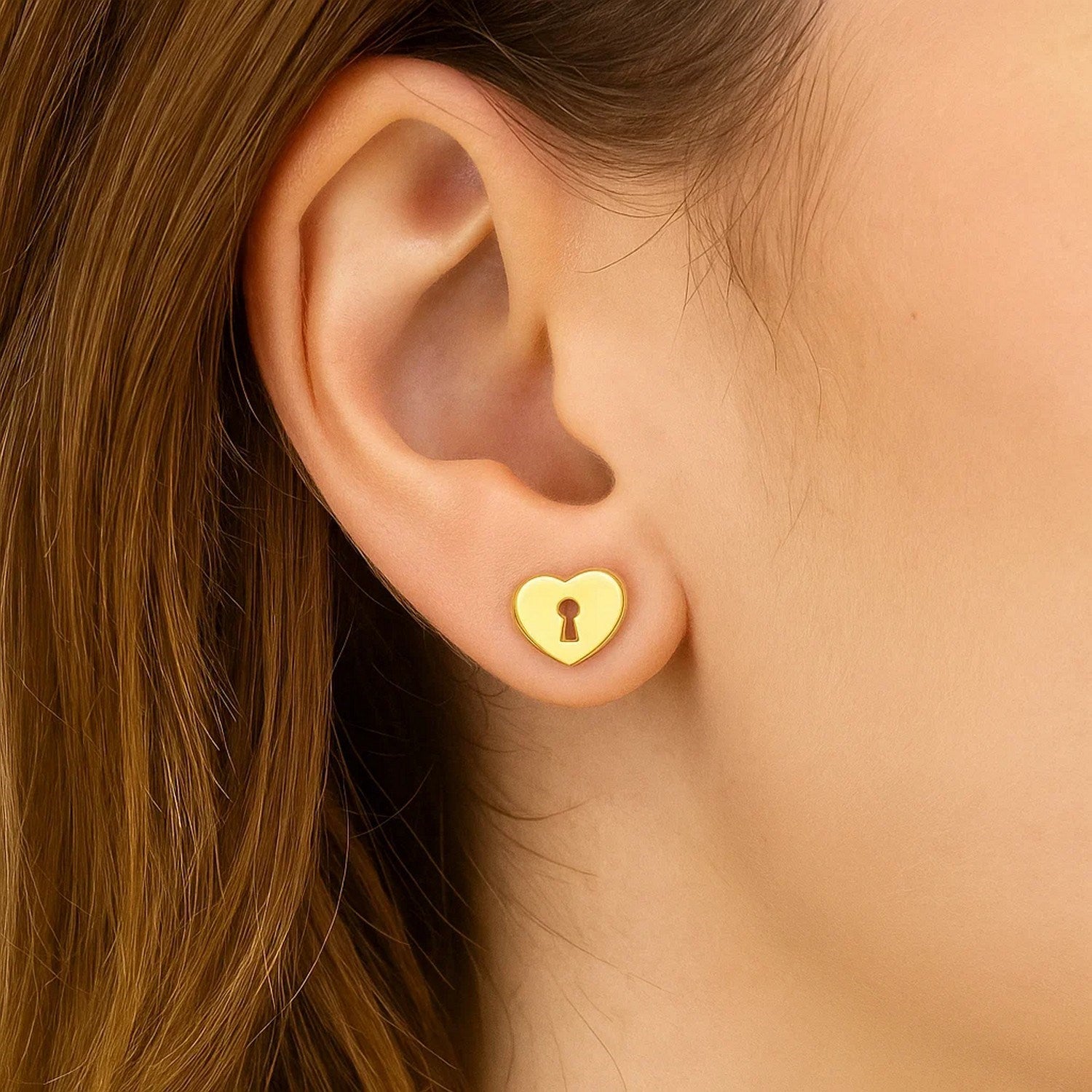 14k yellow gold heart padlock stud earrings with a modern design, perfect for adding elegance to any outfit.