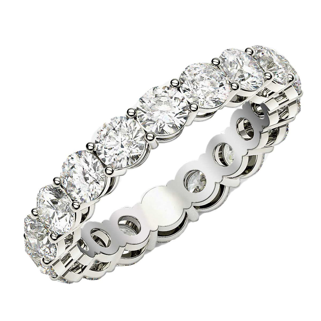 Round cut lab-grown diamond eternity ring in 14k white gold, featuring a modern prong setting for timeless elegance.