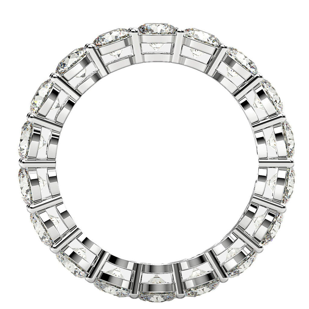 Round cut lab-grown diamond eternity ring in 14k white gold, featuring a modern prong setting and elegant design.