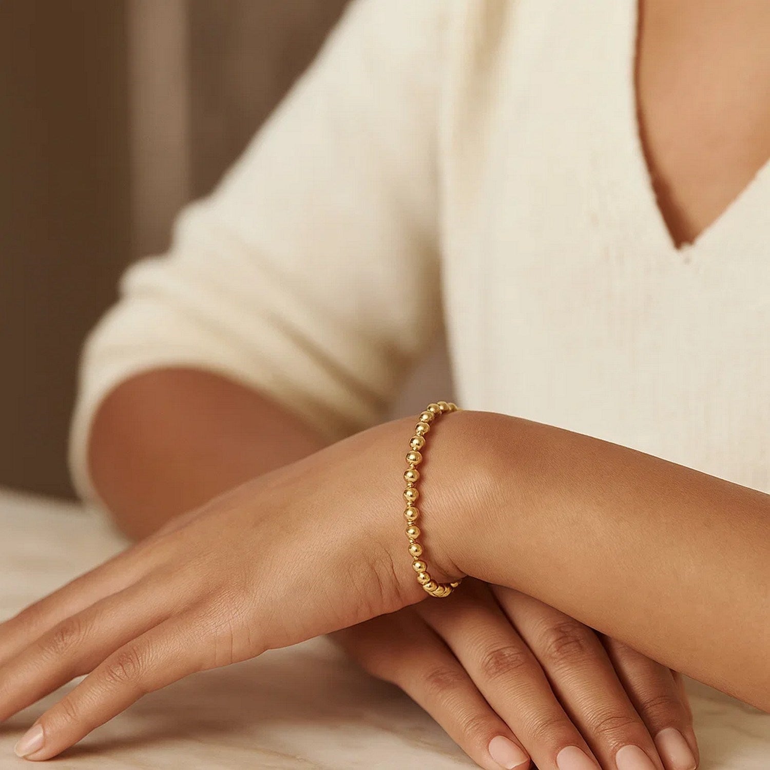 14k yellow gold Moon Cut Bead Chain bracelet featuring contemporary round beads, perfect for elegant layering.