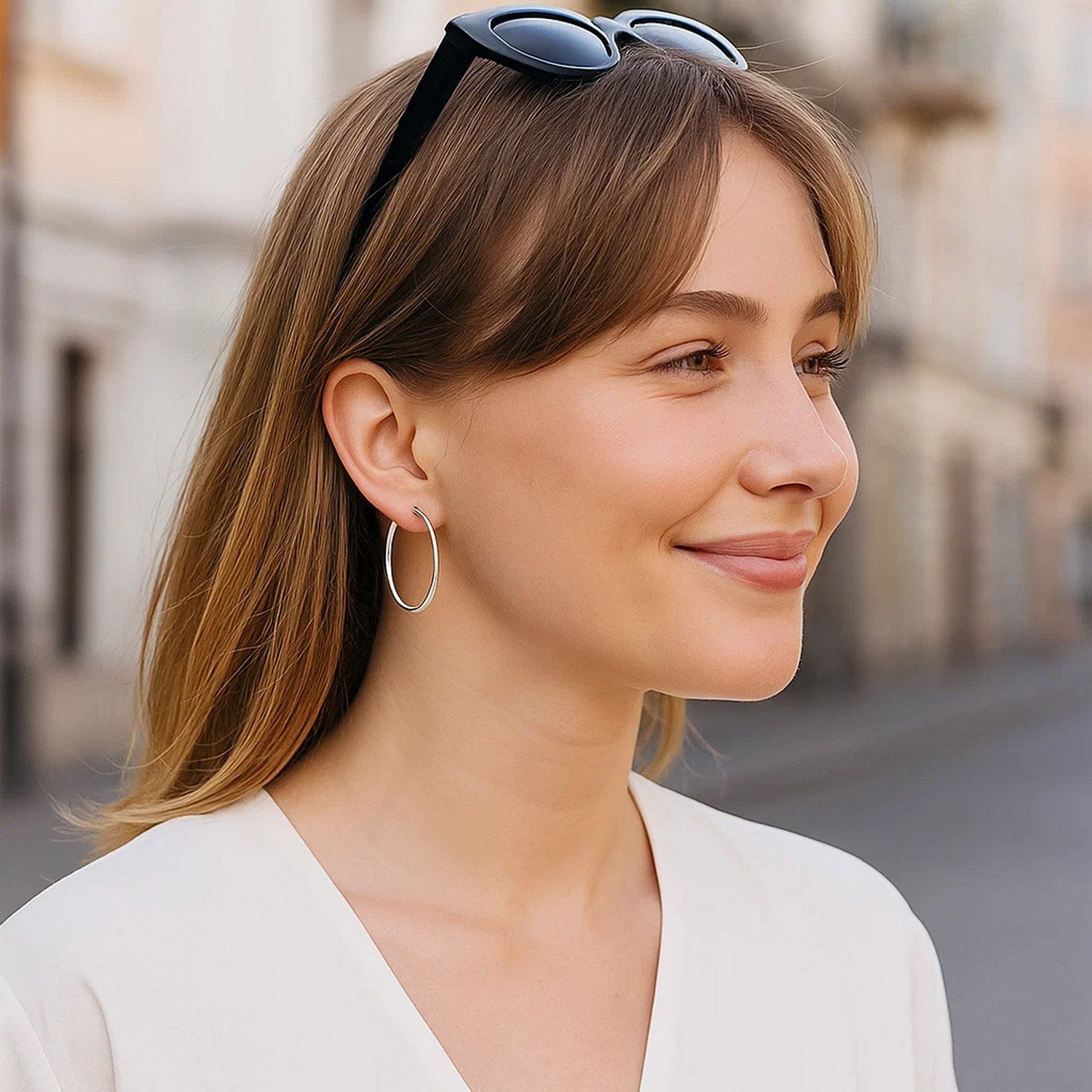 Polished 10k white gold hoop earrings in modern design, crafted from luxurious 14k gold for timeless elegance.