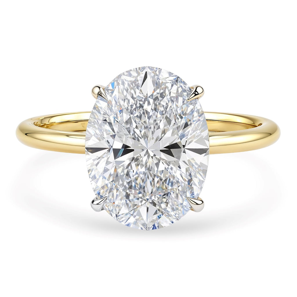 3 carat oval lab-grown diamond solitaire ring in 14k yellow gold with elegant prong setting, showcasing modern luxury.