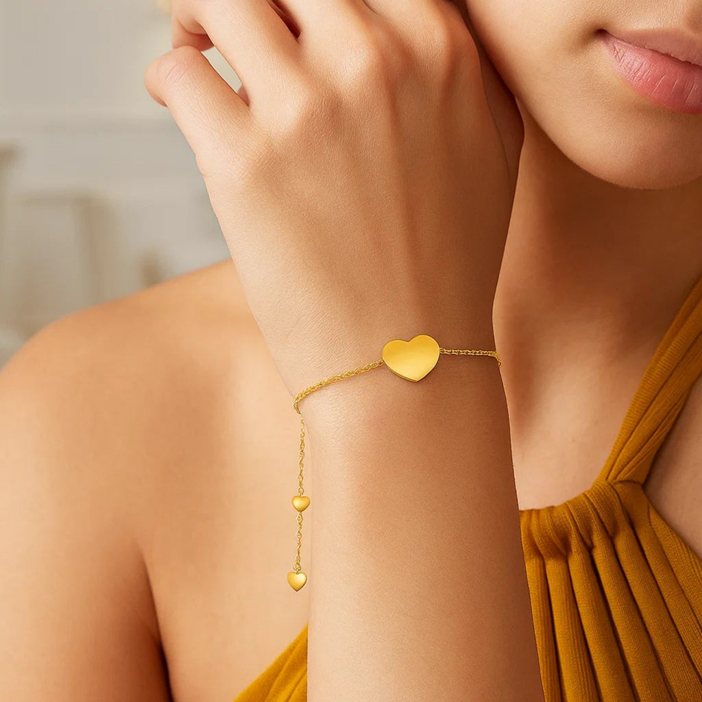 14k yellow gold adjustable heart bracelet featuring a modern chain design, perfect for elegant layering or standalone wear.
