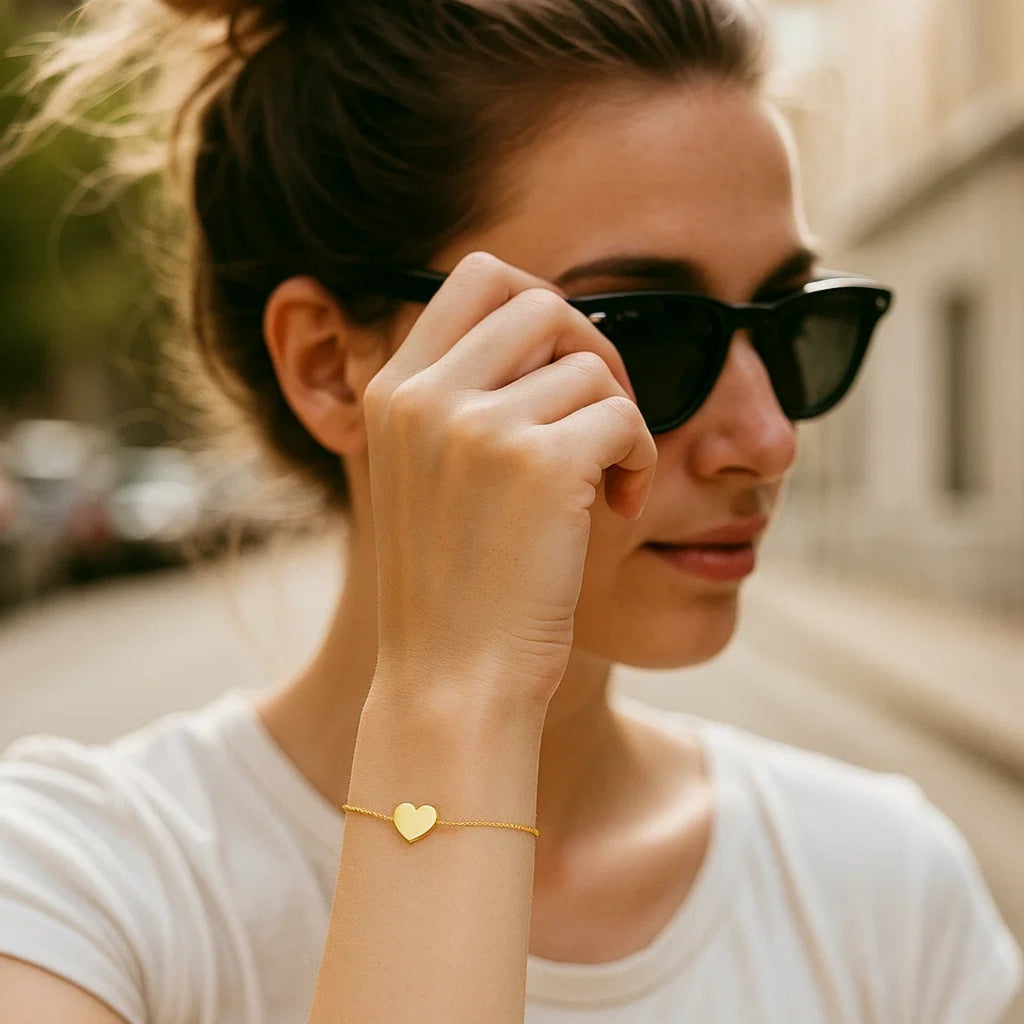14k yellow gold adjustable heart bracelet featuring a modern chain design, perfect for elegant layering or solo wear.