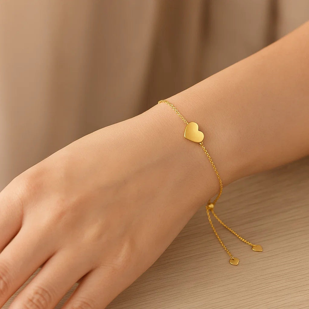 14k yellow gold adjustable heart bracelet with a modern chain design, perfect for layering or standalone elegance.