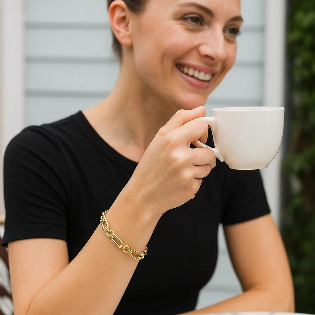 14k yellow gold modern bracelet featuring alternating paperclip and round links for a chic, luxurious look.