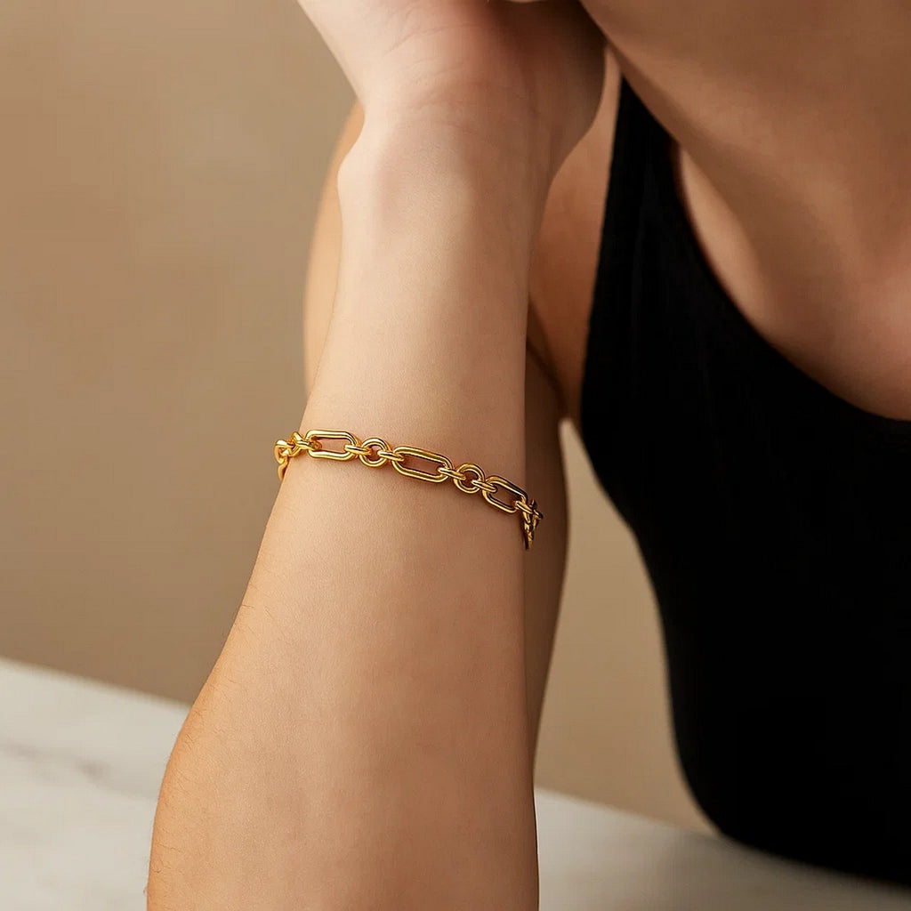 14k yellow gold modern bracelet featuring alternating paperclip and round links, elegant and versatile for any occasion.