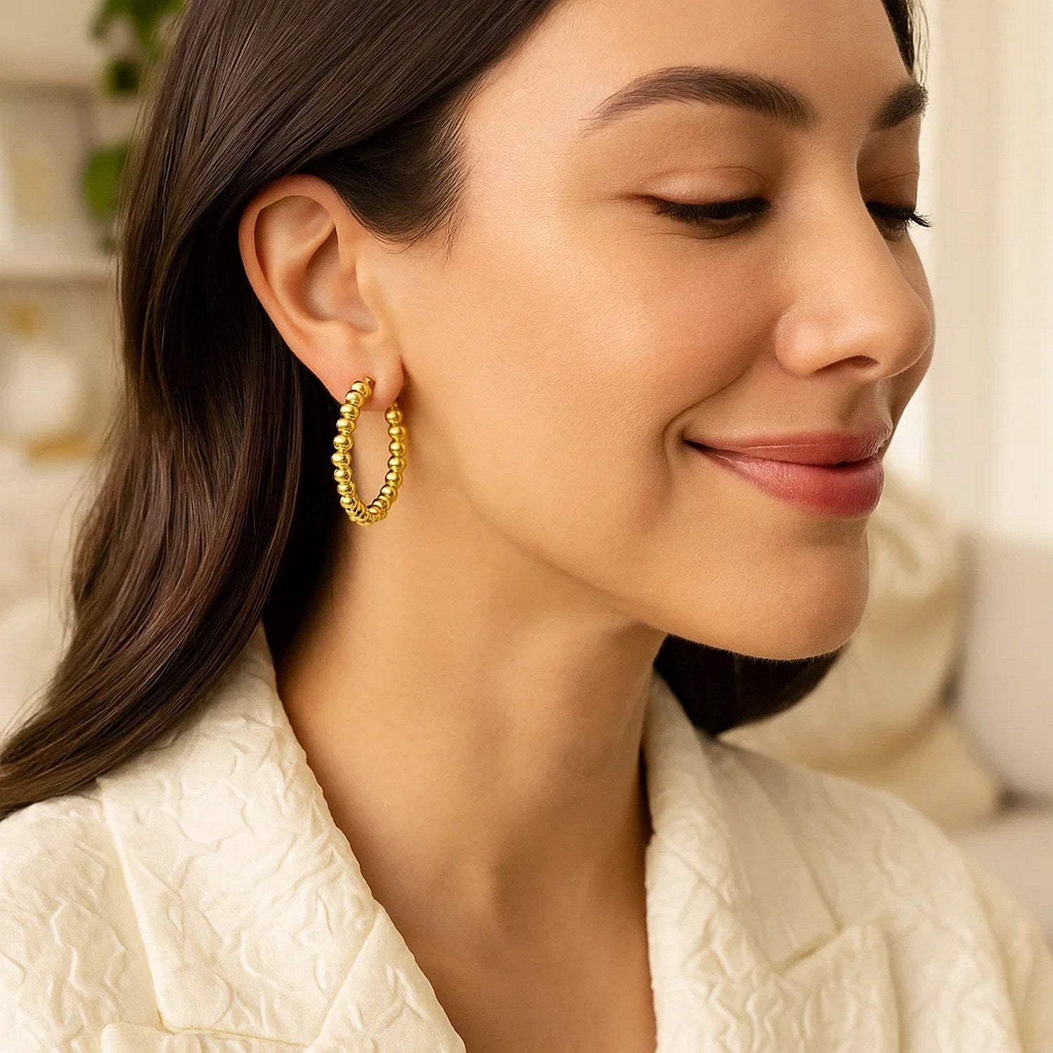 14k yellow gold textured polished hoop earrings with a modern design, perfect for elevating any luxury jewelry collection.