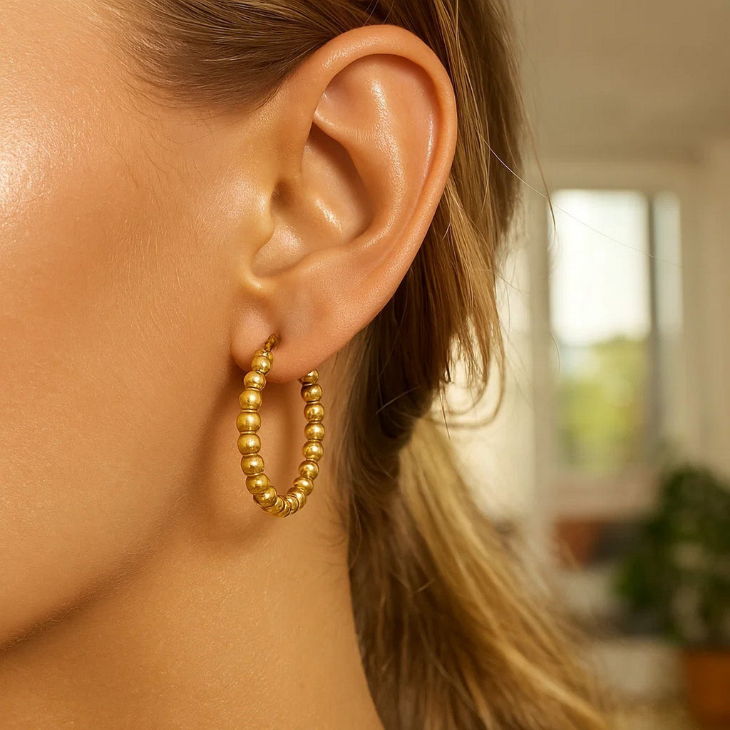 14k yellow gold textured polished hoop earrings showcasing modern elegance and refined craftsmanship.