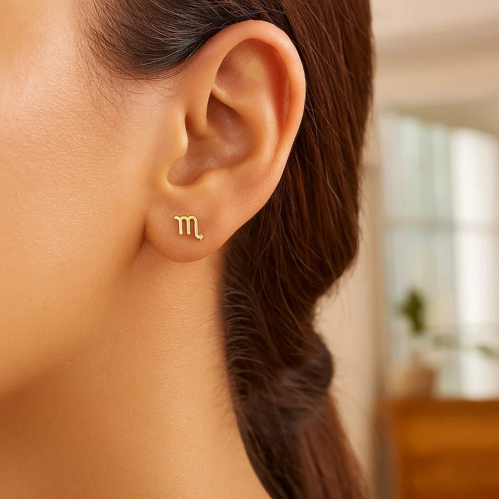 Contemporary 14k yellow gold Scorpio stud earrings with intricate detailing, perfect for a luxurious statement.