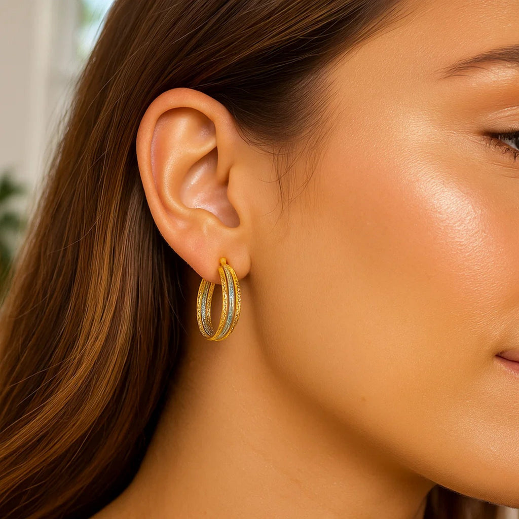 Textured 14k yellow and white gold hoop earrings showcasing modern elegance and luxurious craftsmanship.