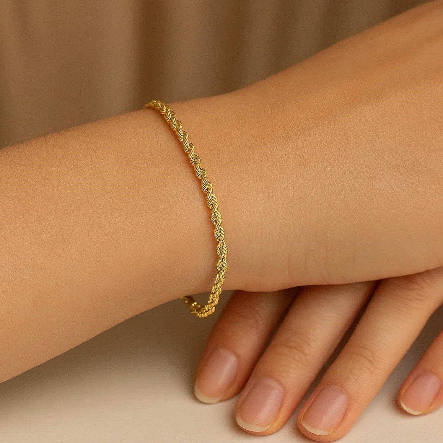 10k yellow gold diamond cut rope bracelet, 2.50 mm, showcasing elegant luxury and intricate craftsmanship.