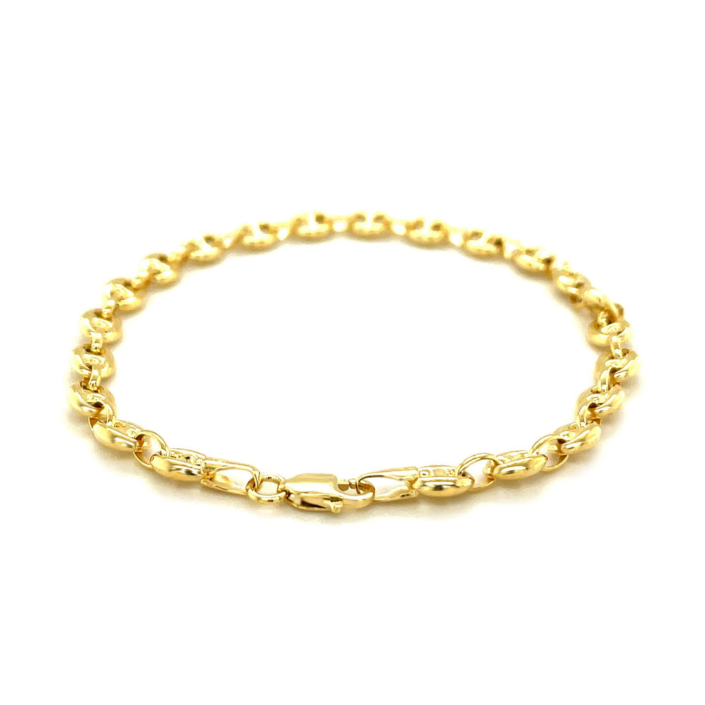 Elegant 14k yellow gold puffed mariner anklet featuring a luxurious chain link design.