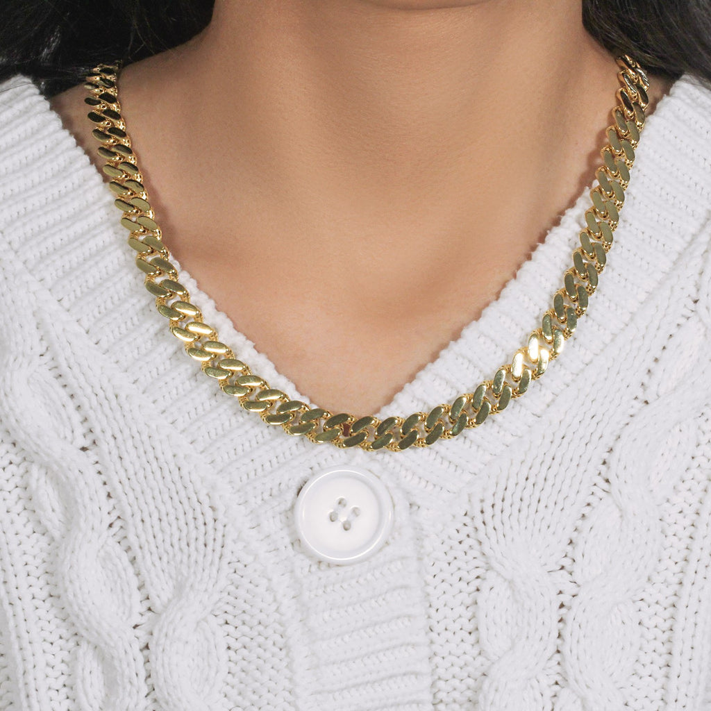 14k two-tone gold curb chain bracelet with white pave accents, showcasing contemporary elegance and luxurious design.