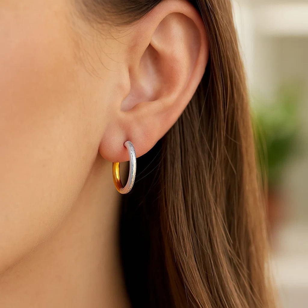 14k two-tone gold hammered hoop earrings with modern design and elegant hinge closure, perfect for sophisticated style.