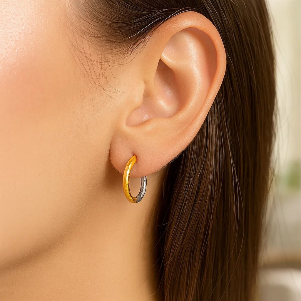 14k two-tone gold hammered hoop earrings with modern design and elegant hinge closure, perfect for any occasion.