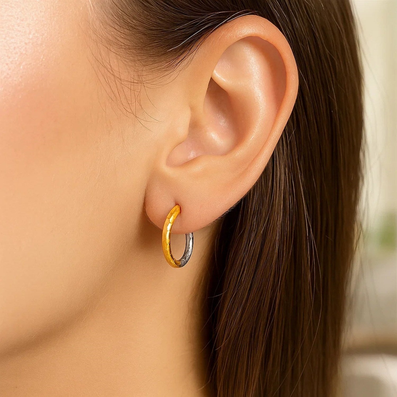 14k two-tone gold hammered hoop earrings with modern design and elegant hinge closure, perfect for any occasion.