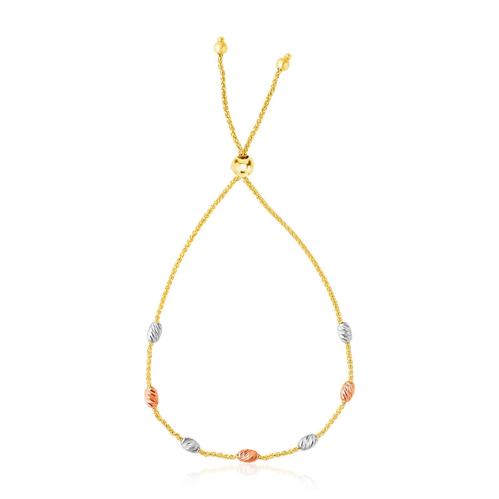 14k tri-color gold textured oval station lariat bracelet adorned with sparkling diamonds, exuding elegance and luxury.