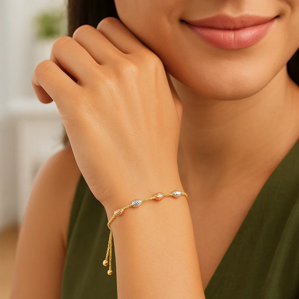 14k tri-color gold textured oval station lariat bracelet featuring elegant links and sparkling diamond accents.